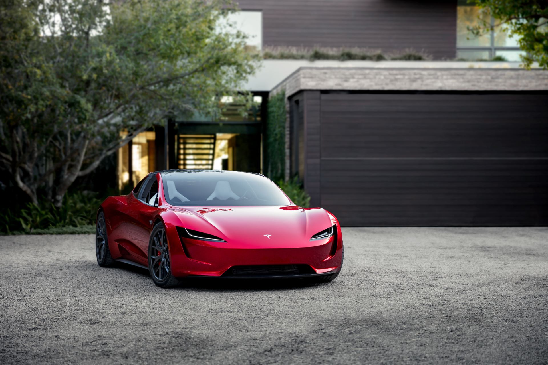 Profile view highlighting the removable glass roof panel and low ride height