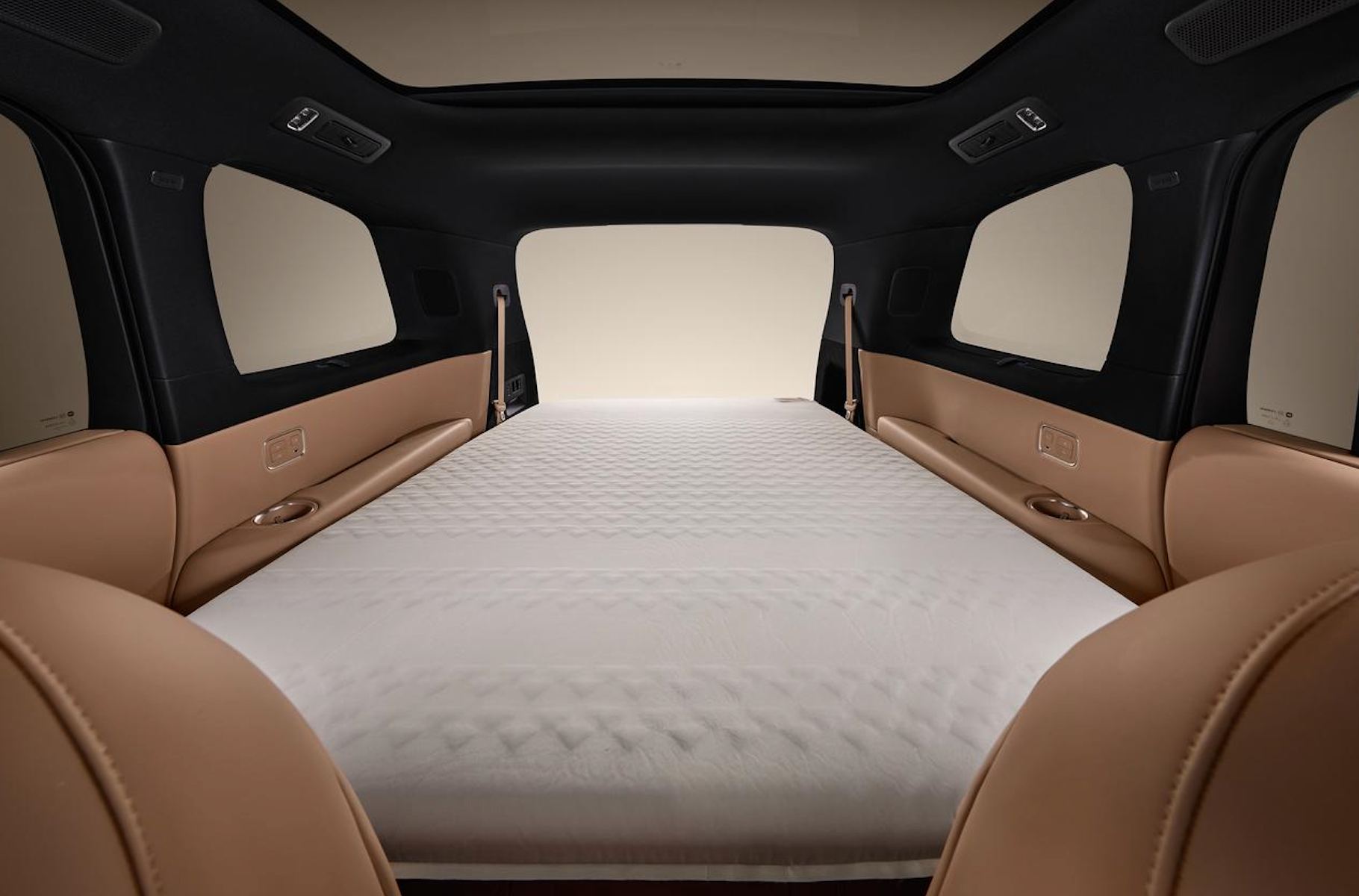 Cargo area in Ultimate Storage Mode loaded with multiple suitcases