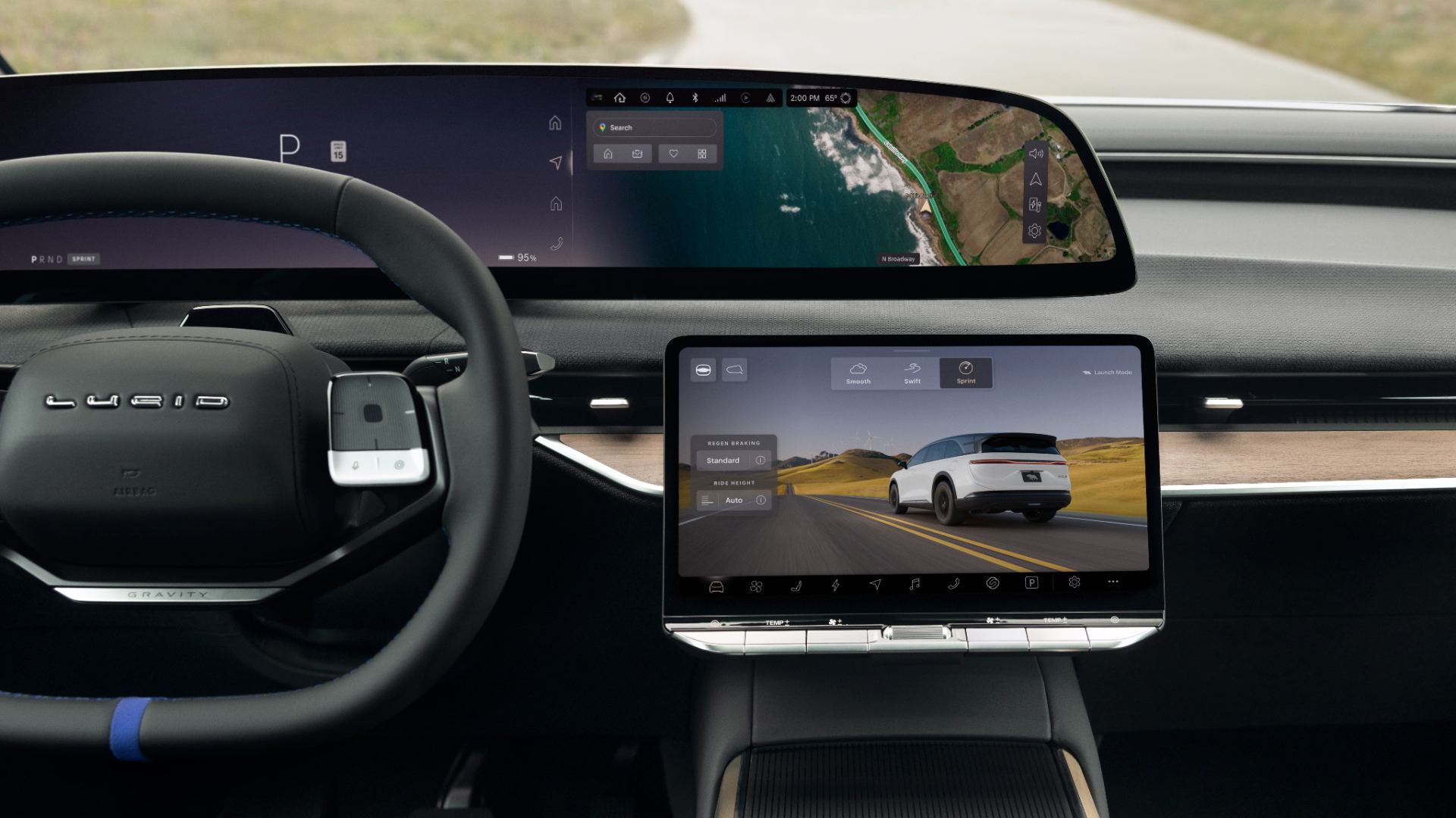 Driver''s view of the curved display, steering wheel with blue marker and centre touchscreen