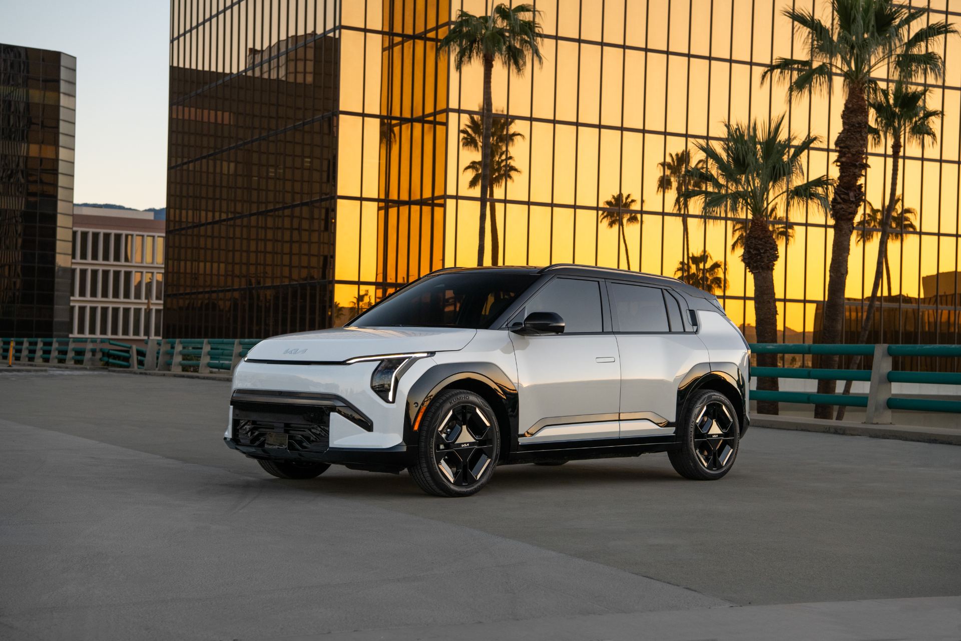 Front three-quarter exterior of the 2027 Kia EV3 in a bright metallic finish, official Kia press photo on a neutral studio backdrop