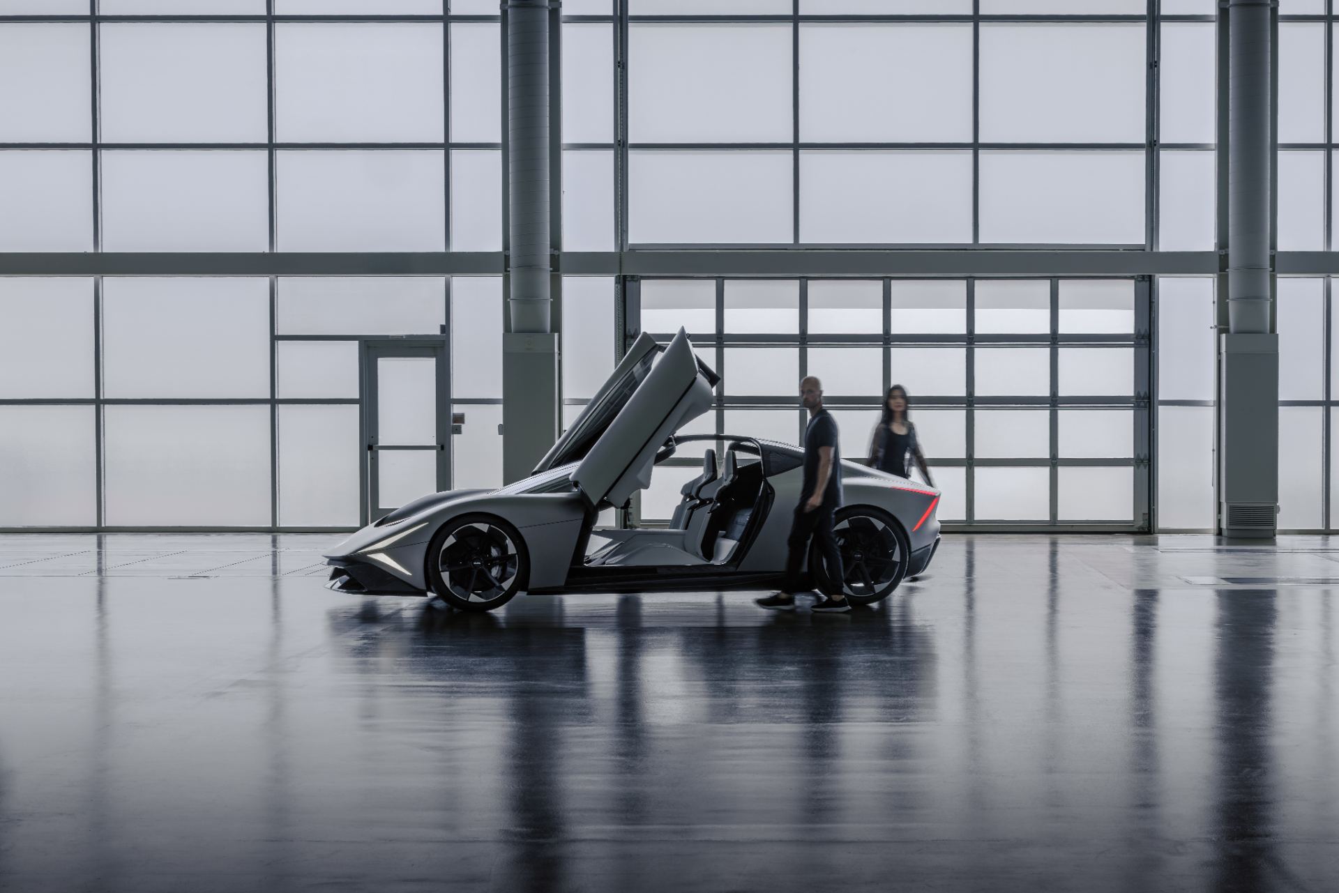 Side profile with a dual-hinge butterfly door open, revealing the glass canopy roof