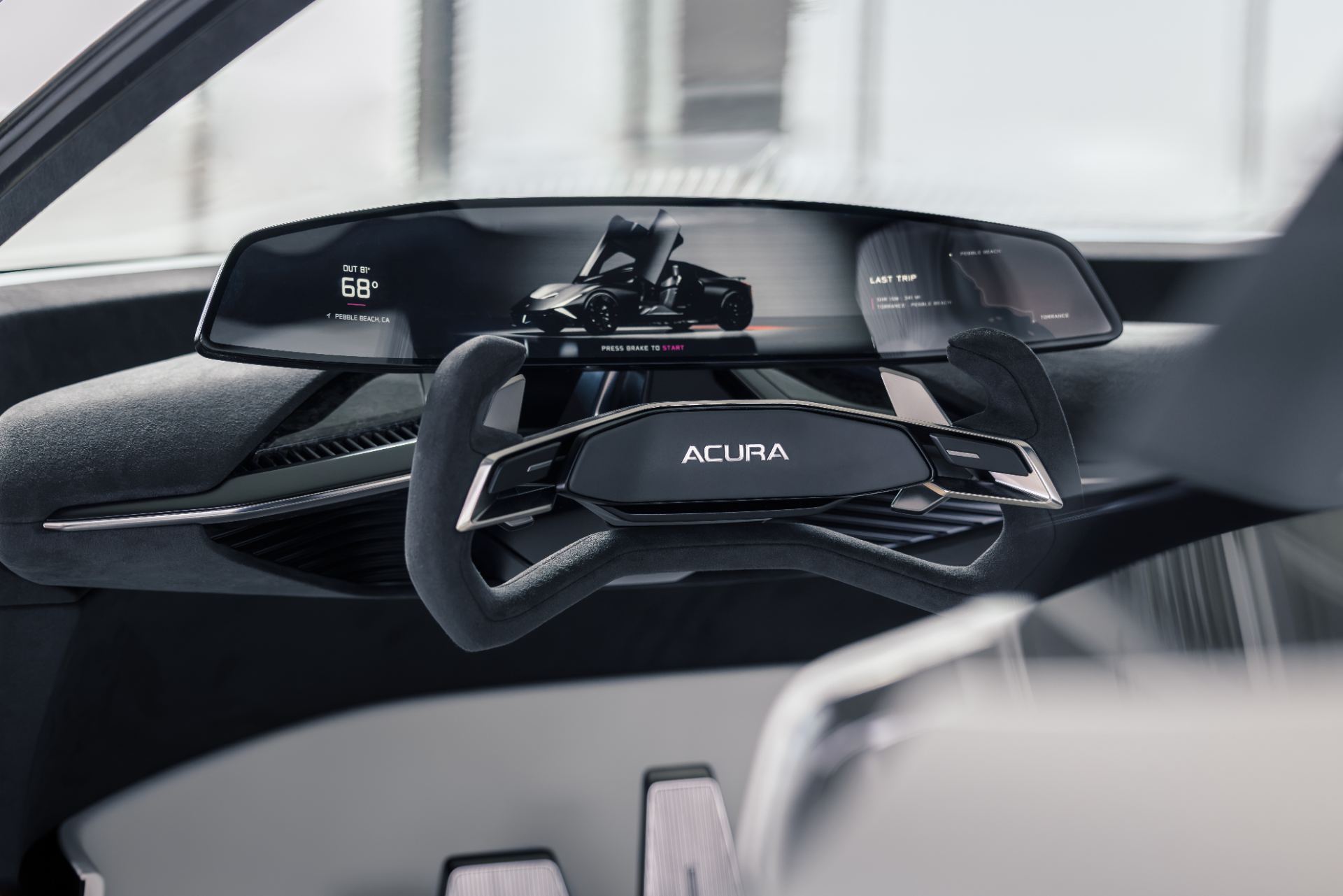 Driver-focused cockpit showing the low fixed seats integrated into the floor and the adjustable steering wheel