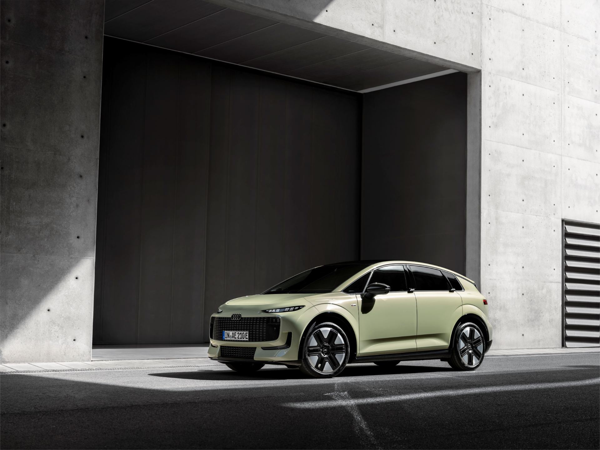 Front three-quarter press photo of the Audi A2 e-tron in Pistachio green, Paris reveal, studio lighting
